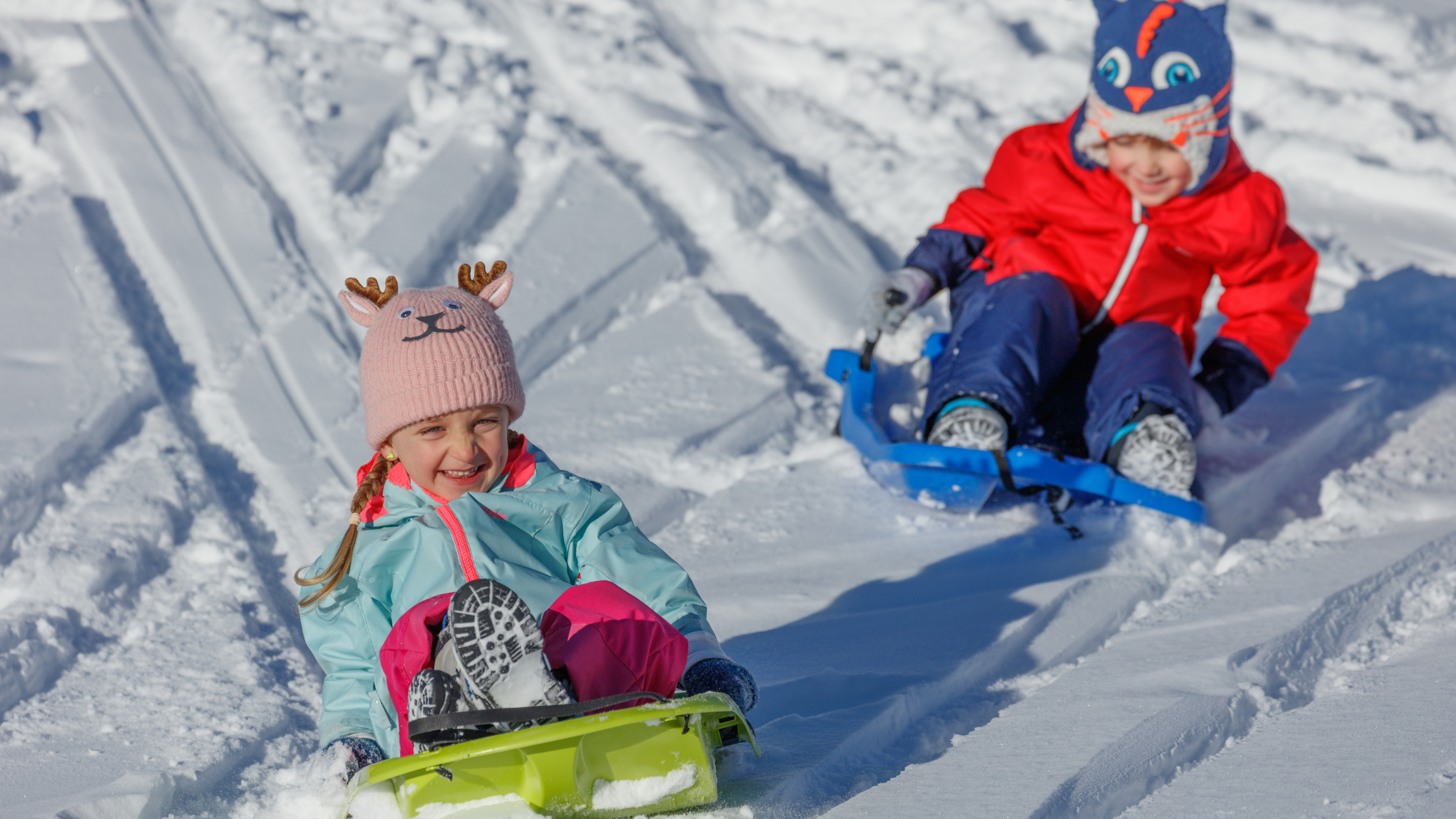 boy and girl sledding